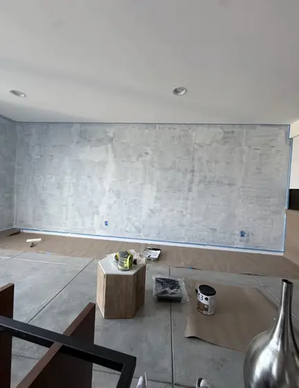 Wall taped and primed for painting