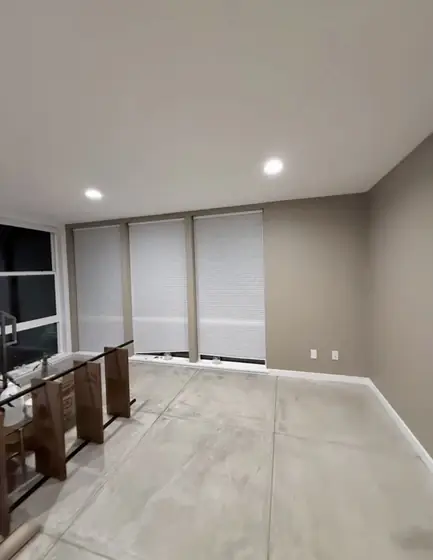 Roller shades installed on tall windows